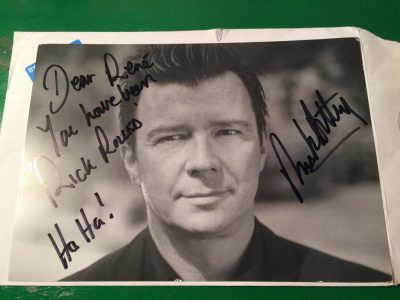 A signed photograph of Rick Astley