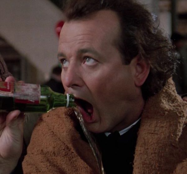 Bill Murray drinking beer as Frank Cross in Scrooged