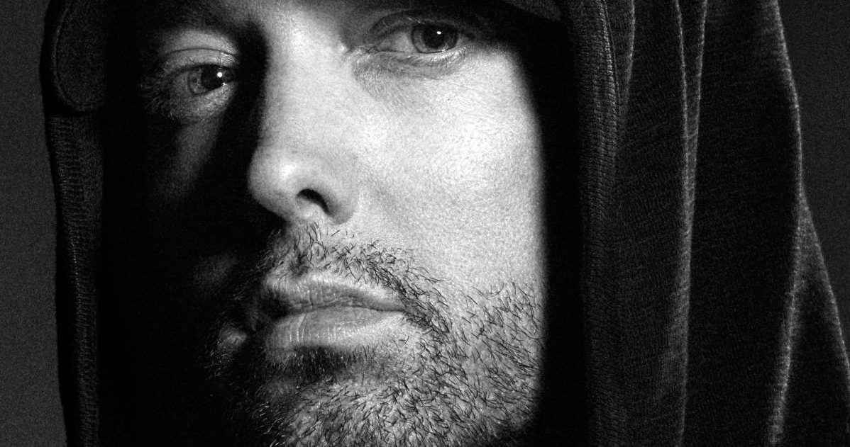 Black and white picture of Eminem in a hoodie.